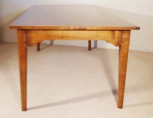 French antique style cherry table with bracketed frame end